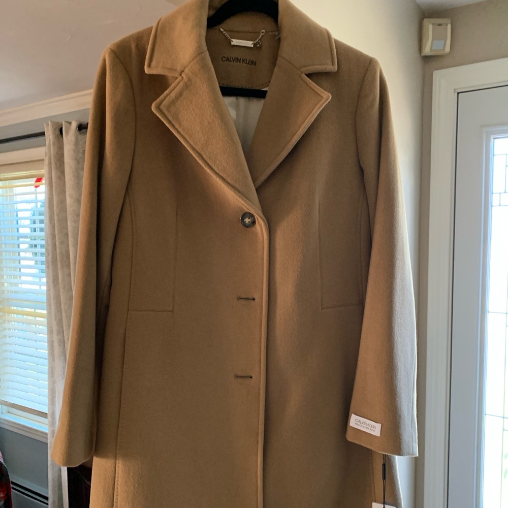 New with tags Calvin Klein car coat. Size Medium. Never worn.